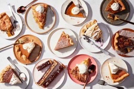 Multiple different slices of pie on plates