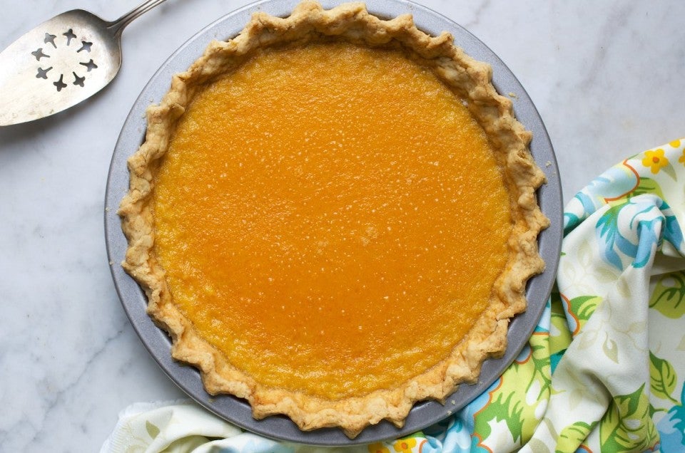 A pumpkin pie with a no-roll pie crust ready to be served