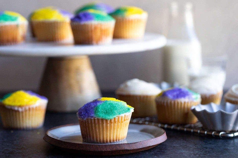 Mardi Gras cupcake with cupcakes in background