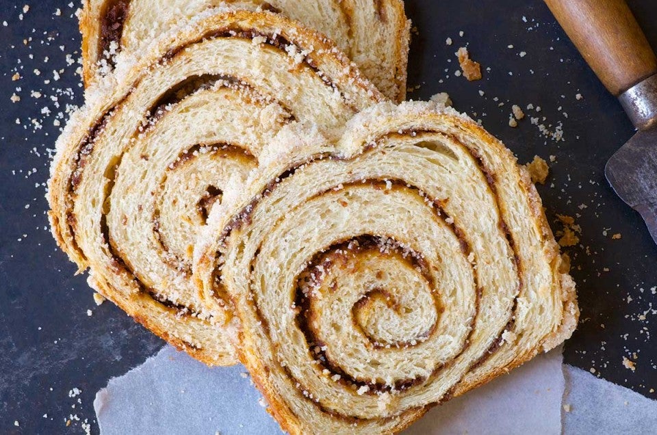 A loaf of cinnamon swirl bread cut into slices