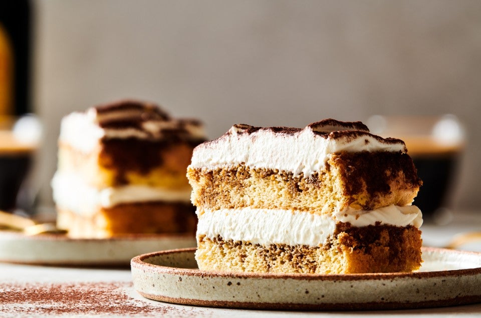 A slice of tiramisu layer cake on a plate