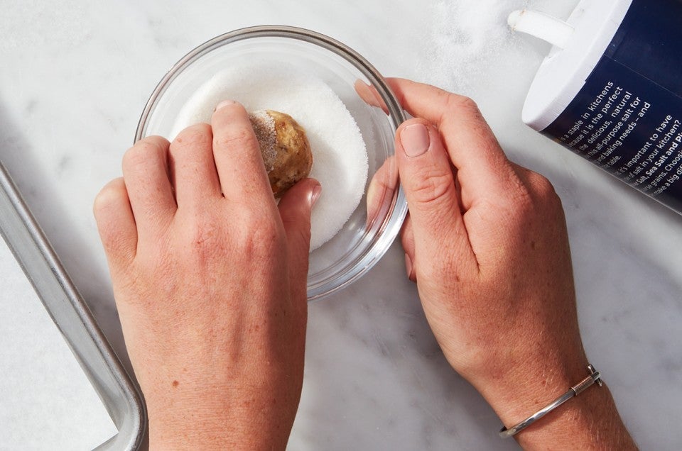 Salty-Sweet Butter Pecan Cookie getting dipped in salt-sugar - select to zoom