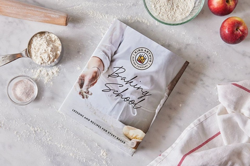 Baking School cookbook on a baking work surface