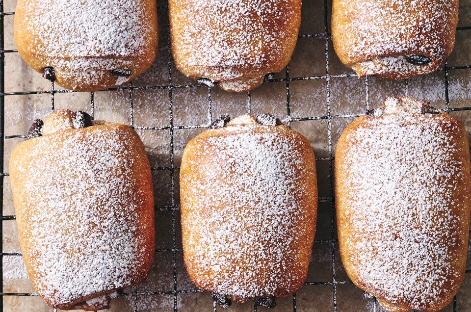 Dark Chocolate-Filled Soft Rolls on a cooling rack - select to zoom