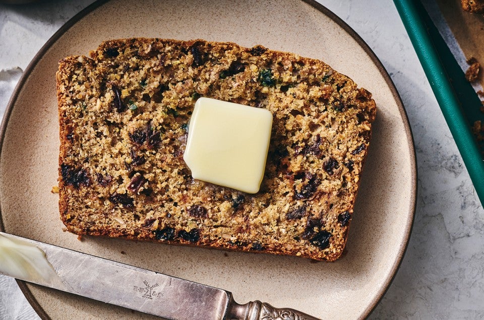 Rye Soda Bread on a plate with a pat of butter - select to zoom