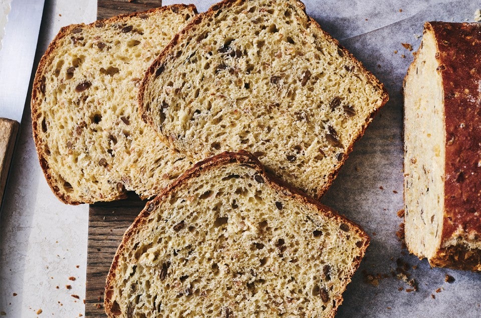 Kansas Sunflower Bread sliced on a cutting board - select to zoom