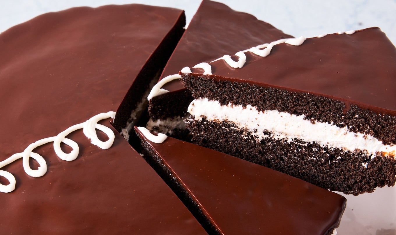Giant Hostess Cupcake Cake being sliced