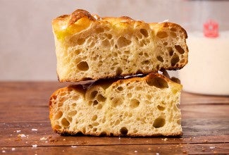 Two slices of sourdough focaccia stacked on top of eachother