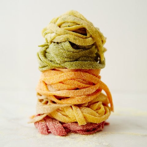 A stack of different colored pasta - select to zoom