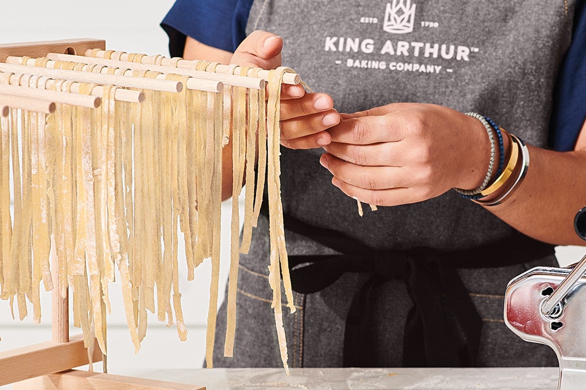 Pasta being dried on a drying rack