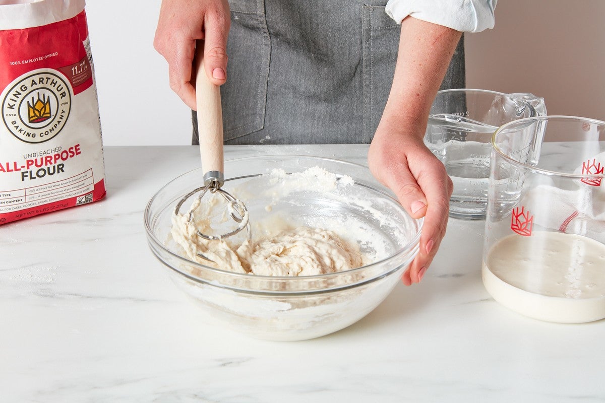 Mix together the sourdough starter to feed it