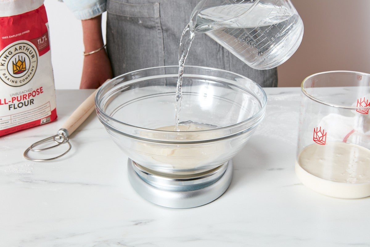 Adding water to feed the sourdough starter