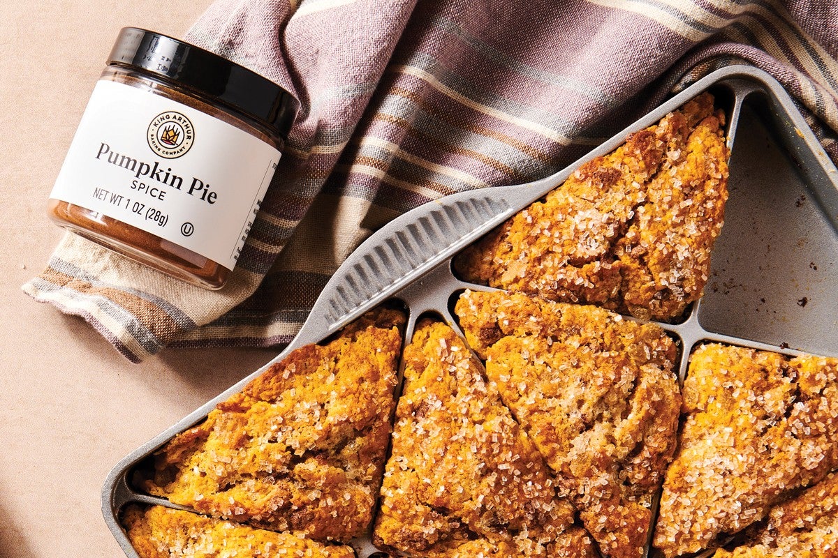 Jar of Pumpkin Pie Spice next to Harvest Pumpkin Scones