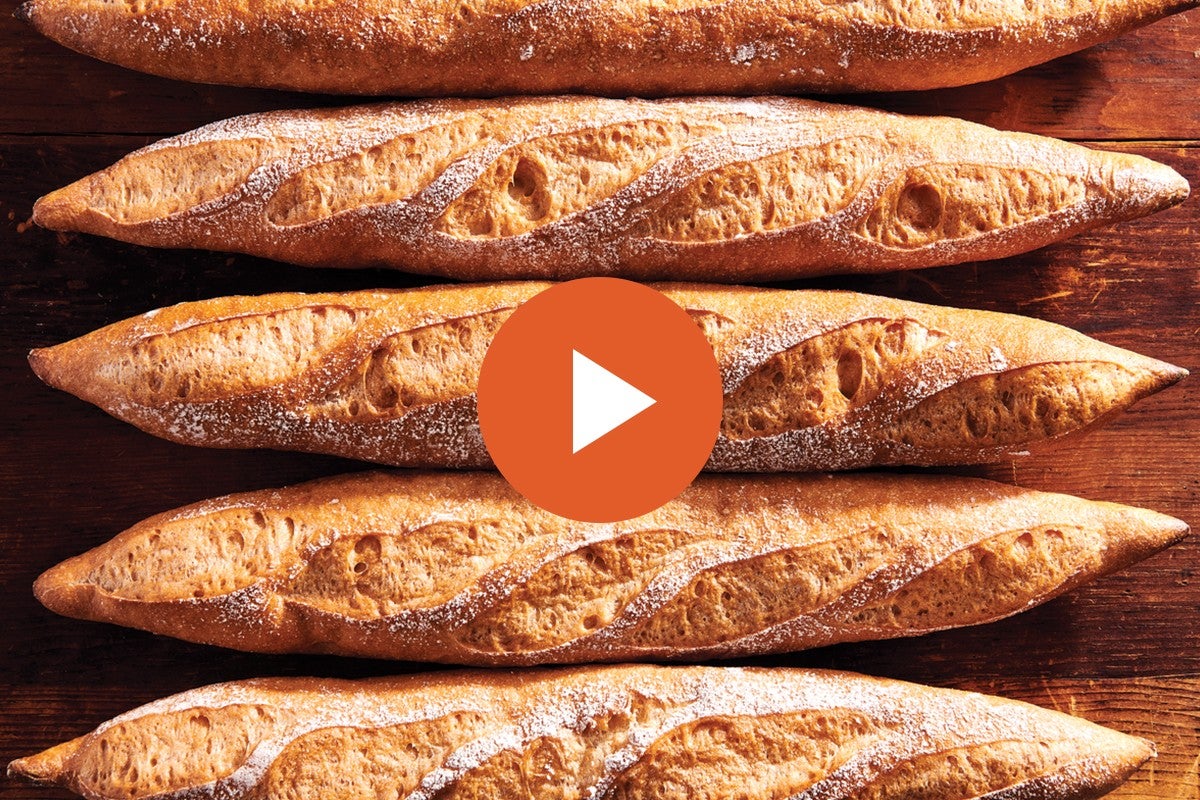 Gluten-free baguettes with graphic of video play button over them 