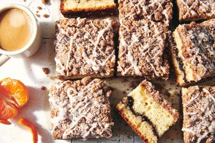 Cinnamon-Crisp Coffee Cake on a table with coffee