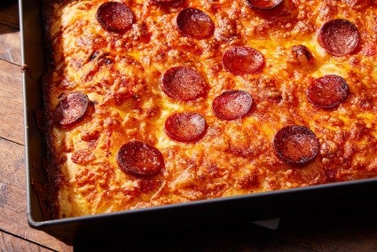 Pizza pepperoni in pan with Detroit style pizza