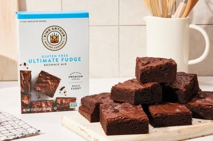 Gluten-free brownie mix next to a plate of gluten-free brownies