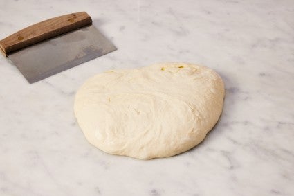 Wet bread dough on work surface