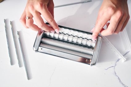 Pasta maker getting prepped to be cleaned