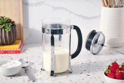 French press full of heavy cream