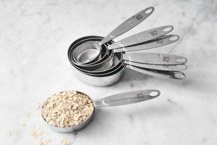 Measuring cups on a marble surface