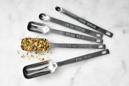 Measuring spoons on a marble surface