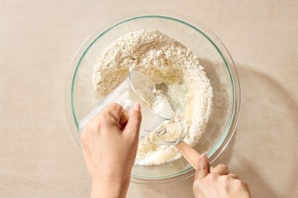 Adding warm water to flatbread dough