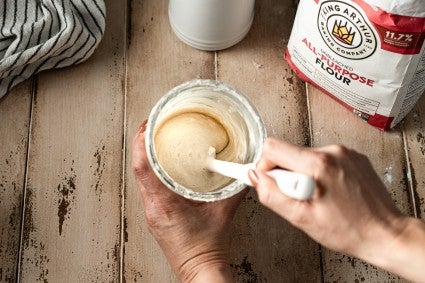 Stirring sourdough starter