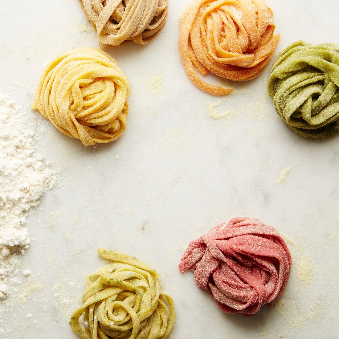 Coils of different colored pasta