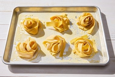 Fresh Pasta nests on a baking sheet