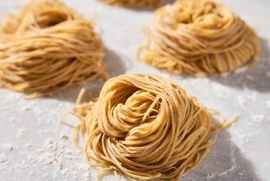 Whole Wheat Pasta nests on parchment